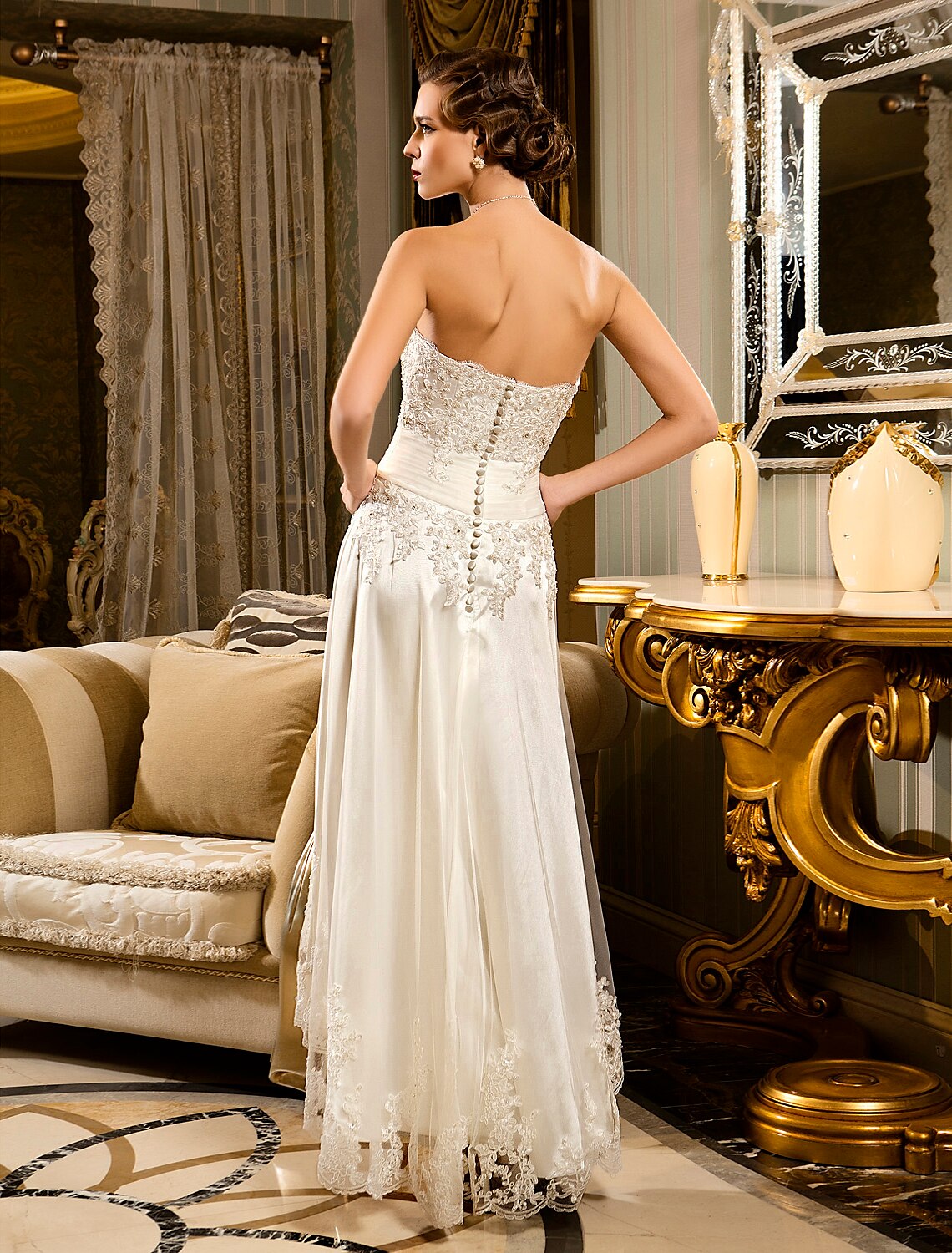 Side view of the elegant A-line reception dress with asymmetrical skirt.