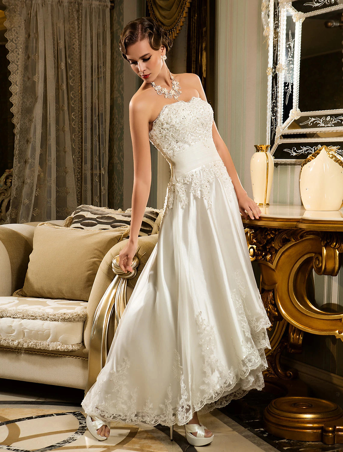 Full length view of the model in the white bridal reception dress.