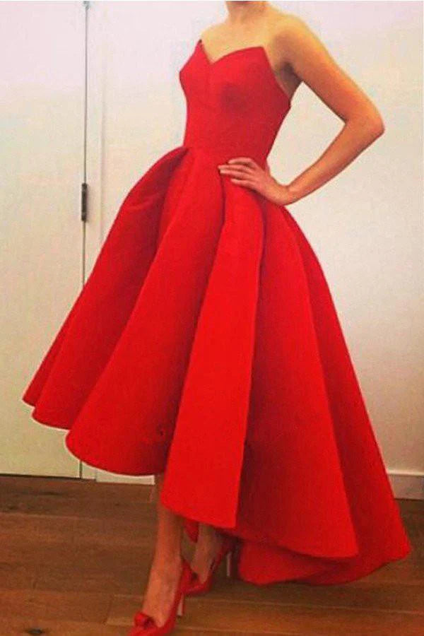 Elegant A-line sweetheart strapless prom dress in satin with high-low hem and ruffles.