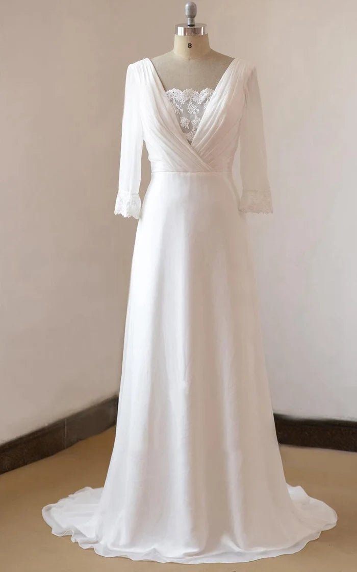 Model wearing an elegant A-line lace and satin wedding gown with a sweetheart neckline.