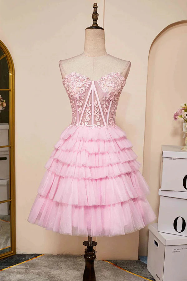 Elegant pink A-line homecoming dress with a sweetheart neckline and layered skirt.