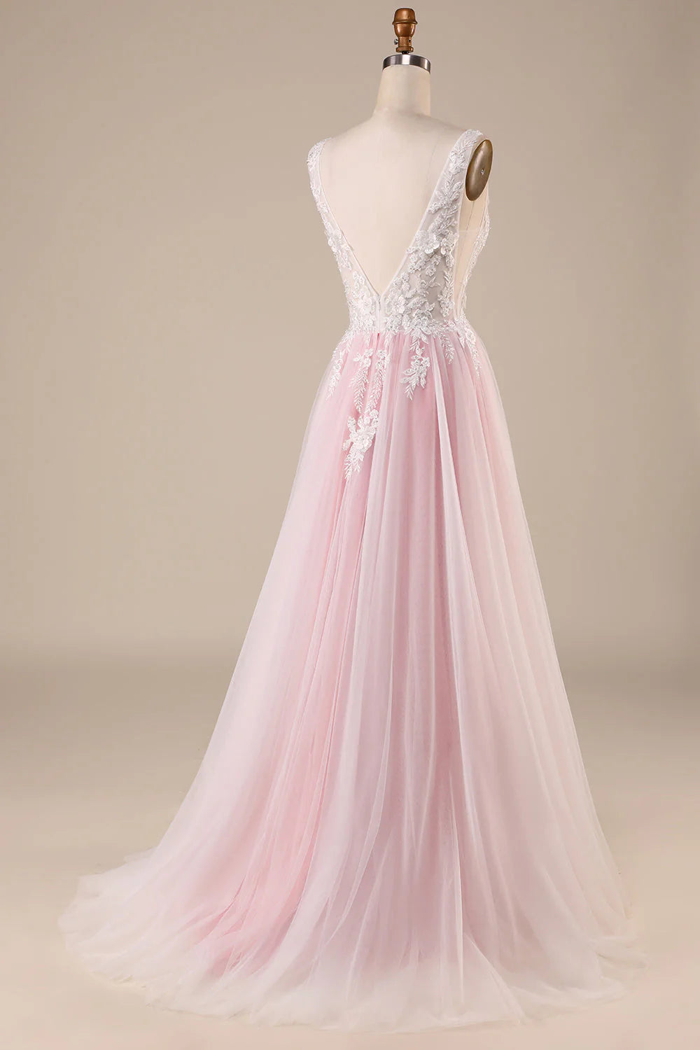 Back view of an A-line wedding gown showing the sweep train and delicate tulle fabric.