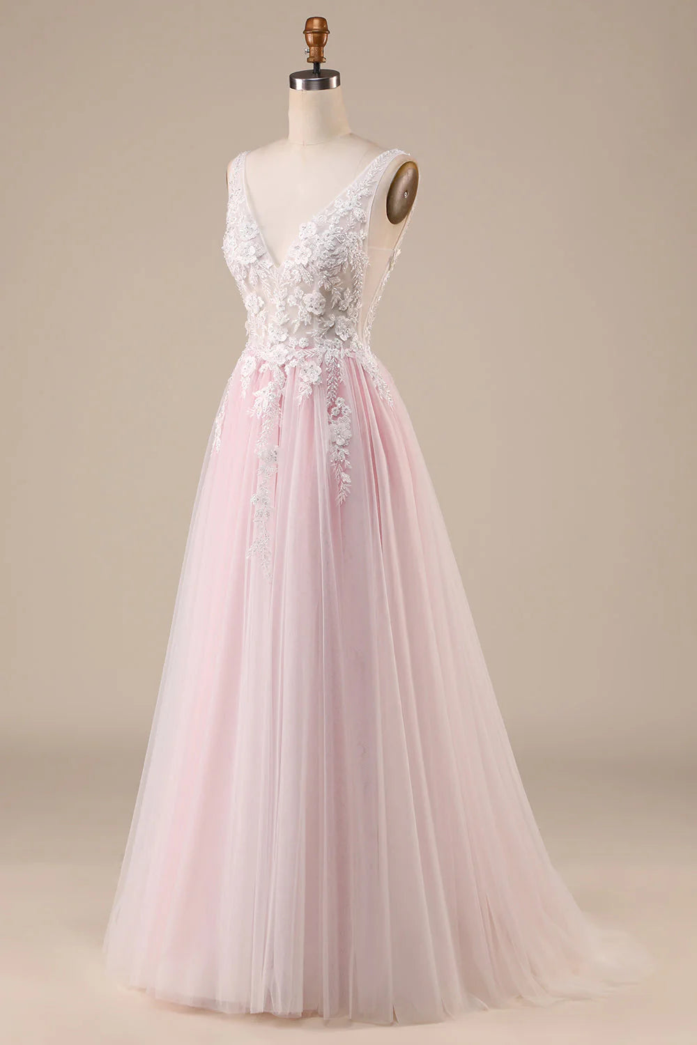 Close-up of the sweetheart neckline and bodice of an ivory pink tulle wedding dress.