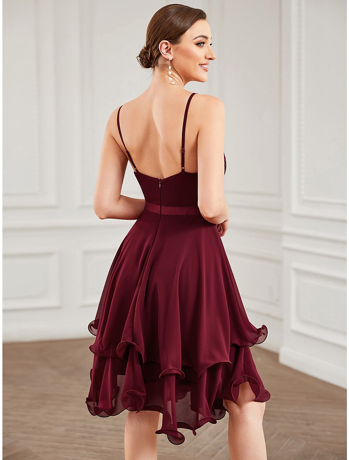 Side profile of the A-line sweetheart tiered chiffon dress.