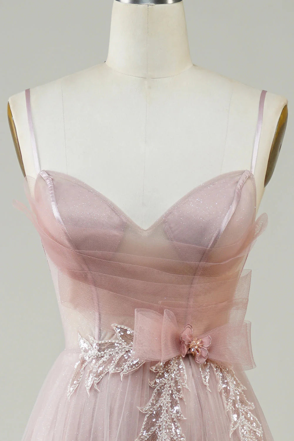 Back view of long blush A-line prom dress.