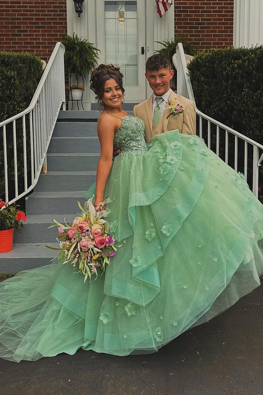 Sage green A-line prom dress with sweetheart neckline and appliques.