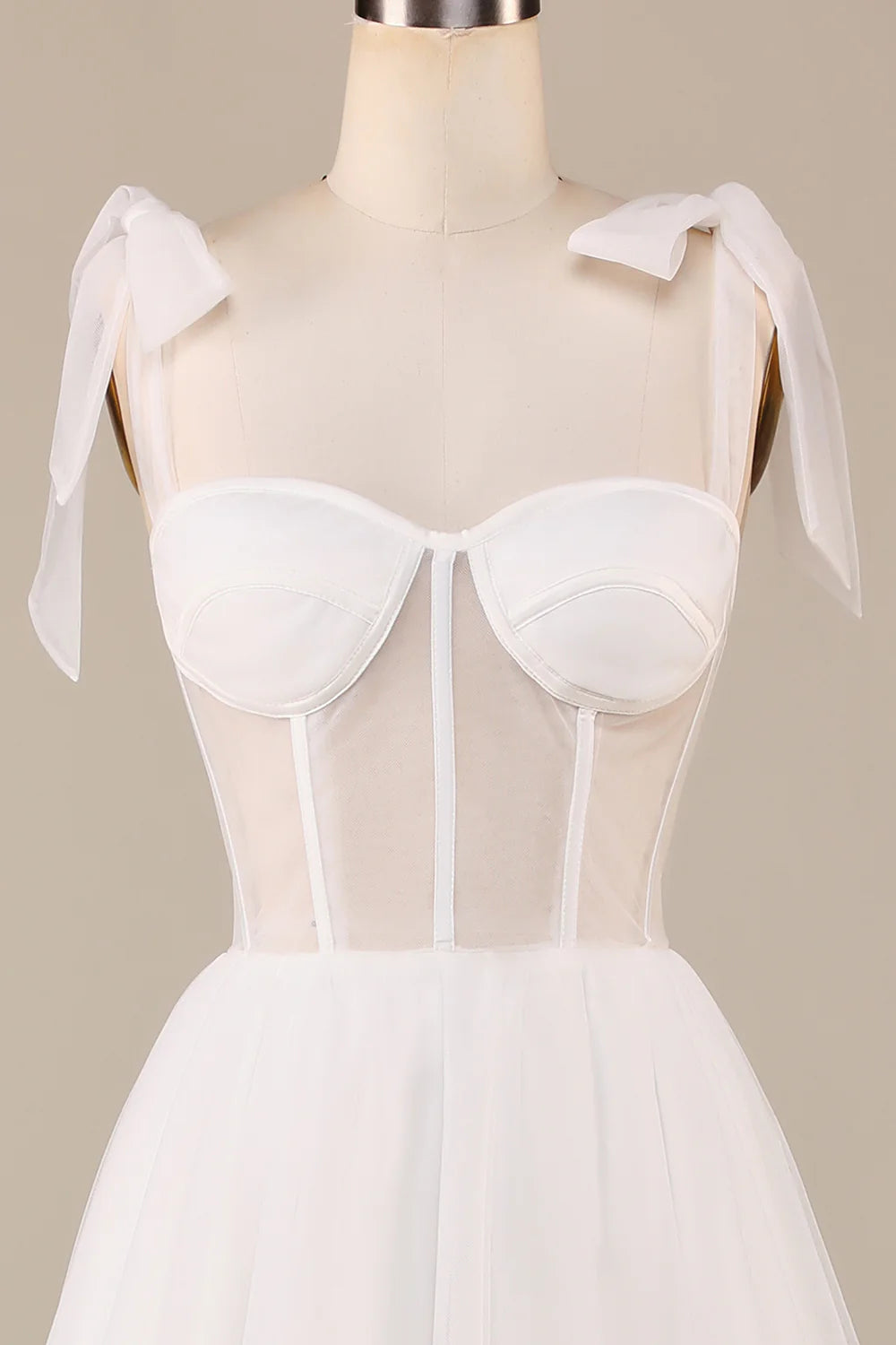 Back view of romantic ivory wedding dress with corset detailing.