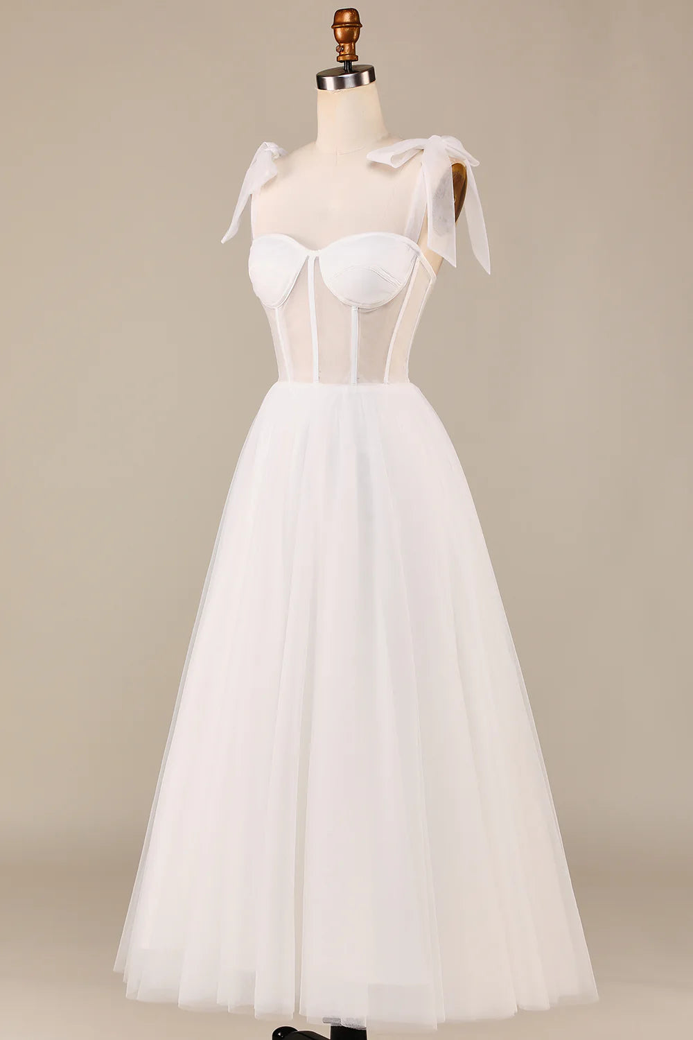 Bride wearing a beautiful ivory tulle wedding dress.