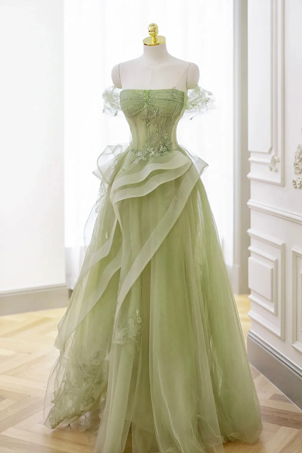 Back view of the green prom dress, showcasing the corset detailing.