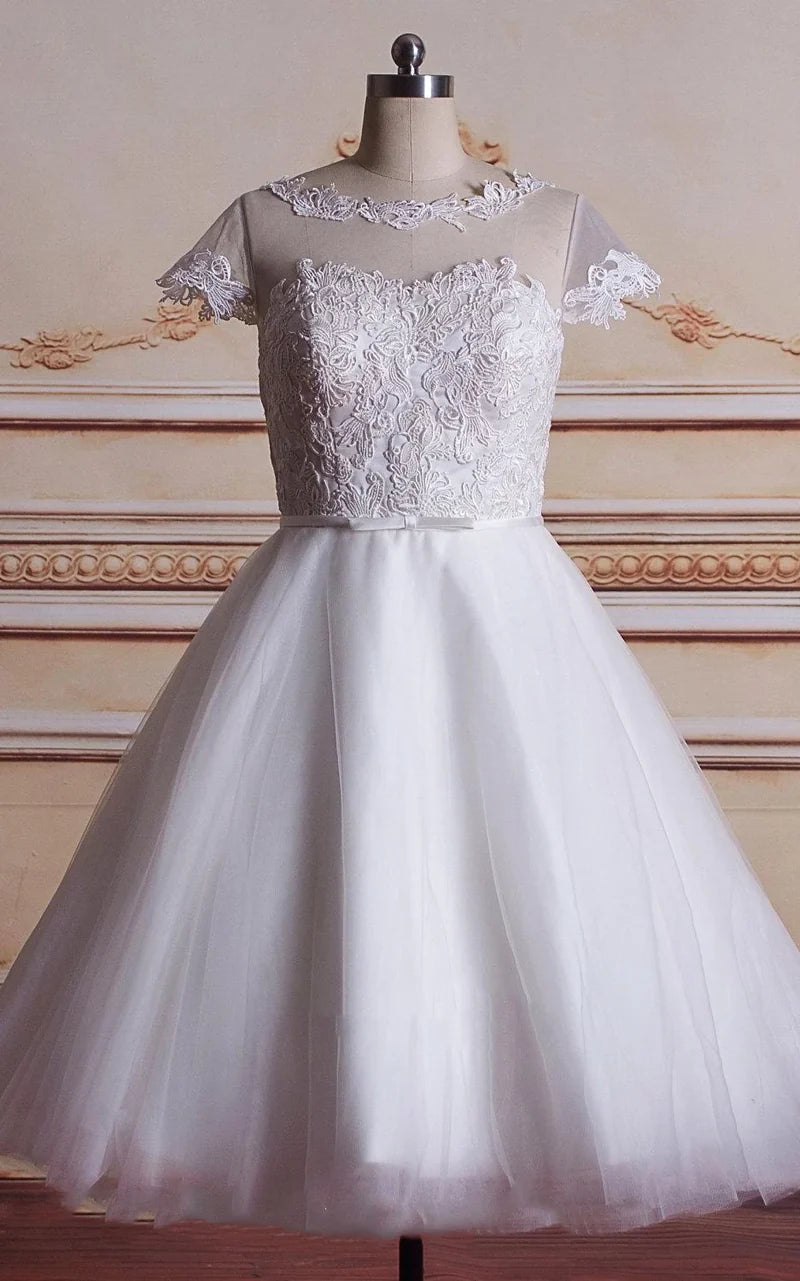 Elegant A-line tea-length wedding dress with lace bodice and satin skirt.