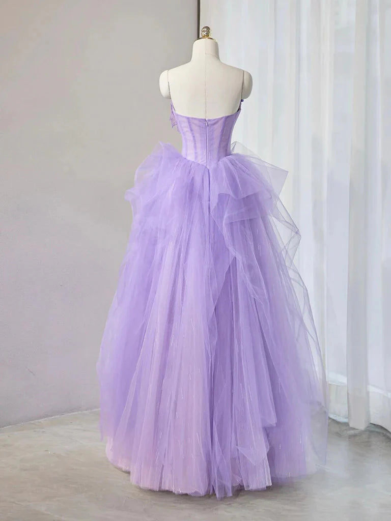 Close-up of sweetheart neckline and 3D floral embellishments on tulle dress.