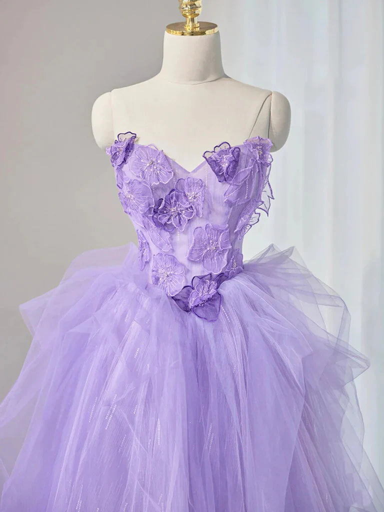 Back view of elegant A-line long evening gown with flowing tulle skirt.