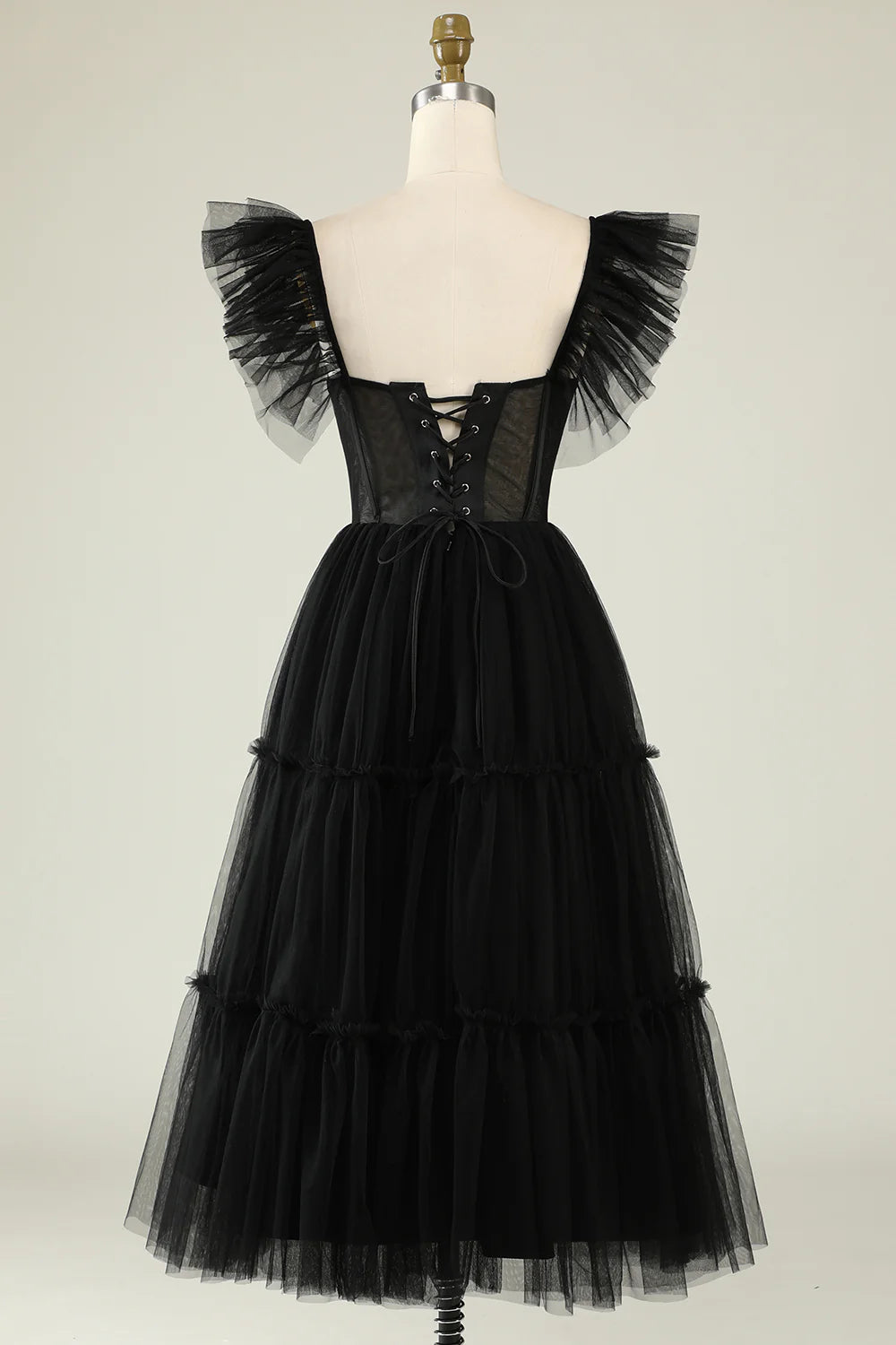 Close-up of the sweetheart neckline and bodice details of the tulle dress.
