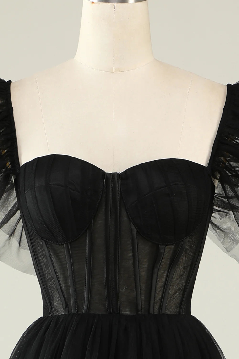 Side view showcasing the flowing A-line silhouette of the tulle prom dress.