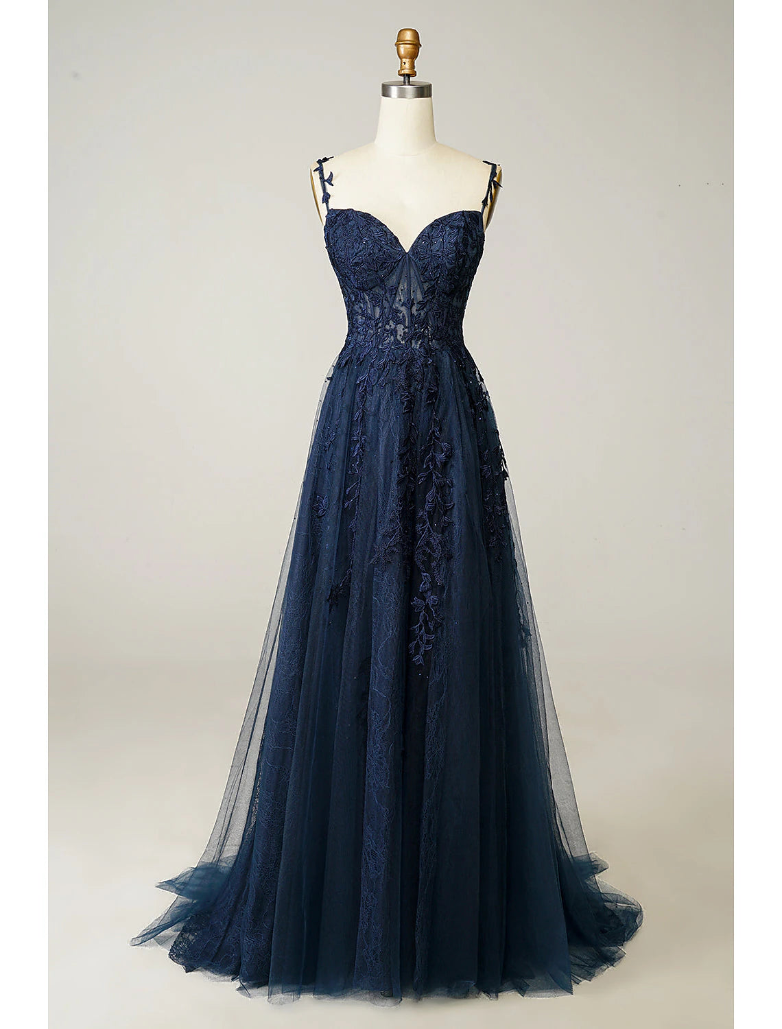 Model wearing an elegant A-Line sweetheart tulle prom dress with beading and a high slit.