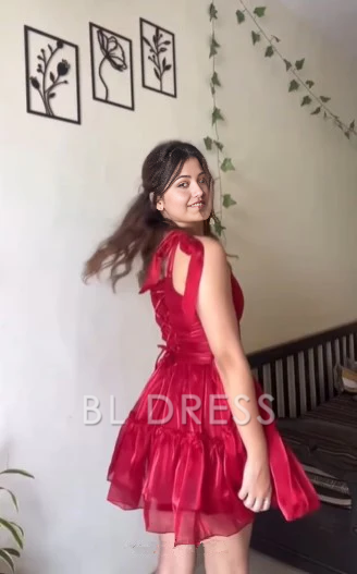 Red A-line sweetheart tulle short dress on a model.