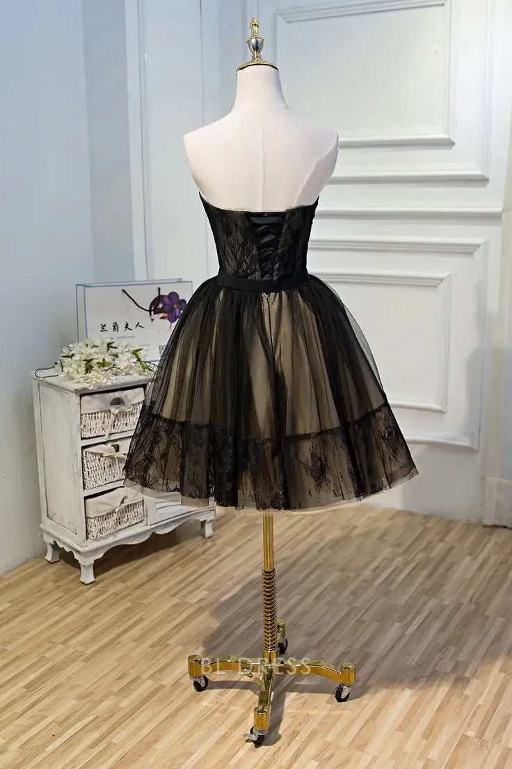 Back view of an A-line sweetheart tulle short dress on a model.