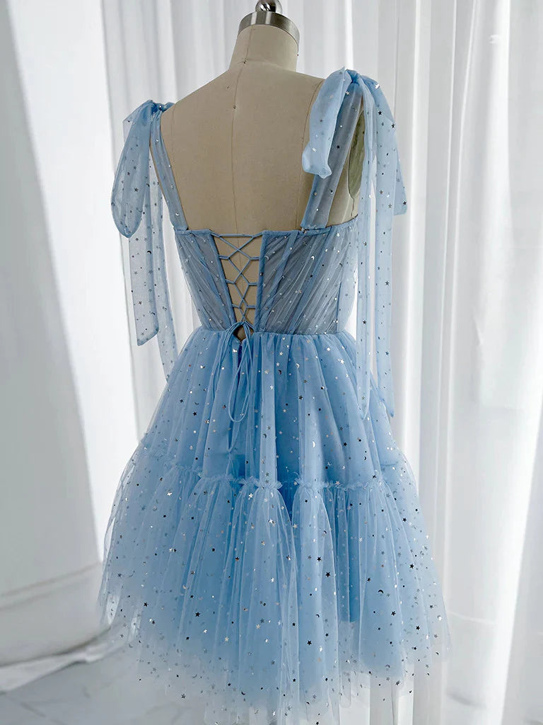 Model wearing a charming short tulle party dress.