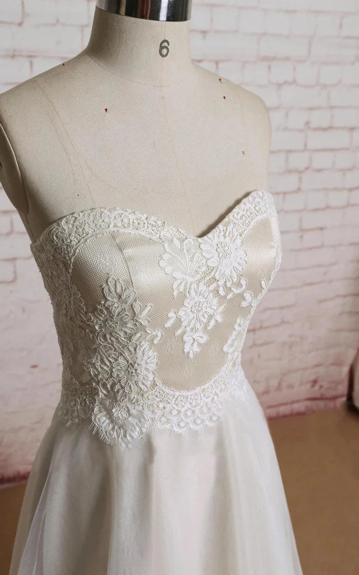 Side view of A-line tulle wedding dress with sweetheart neckline.