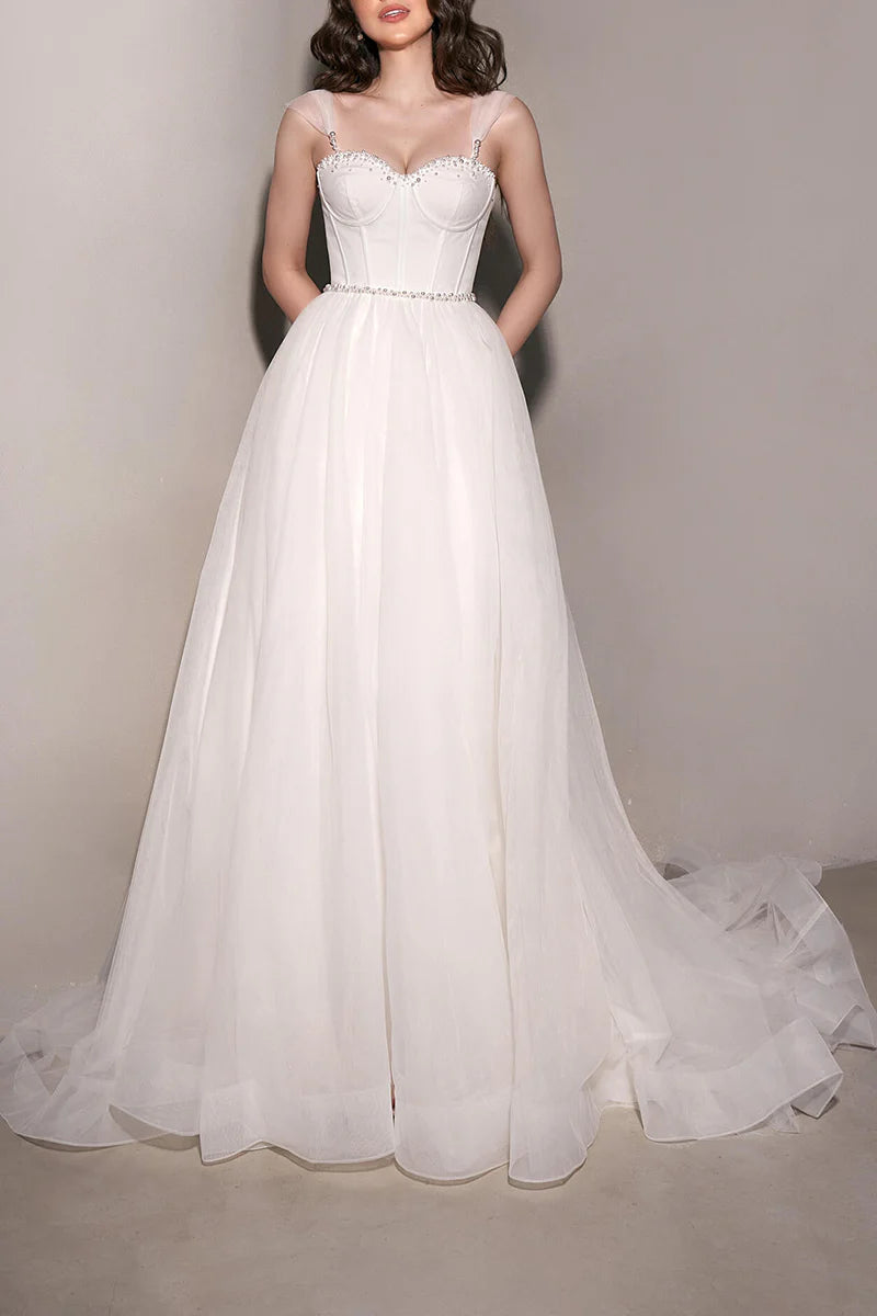 Model wearing an elegant A-line sweetheart tulle wedding dress.