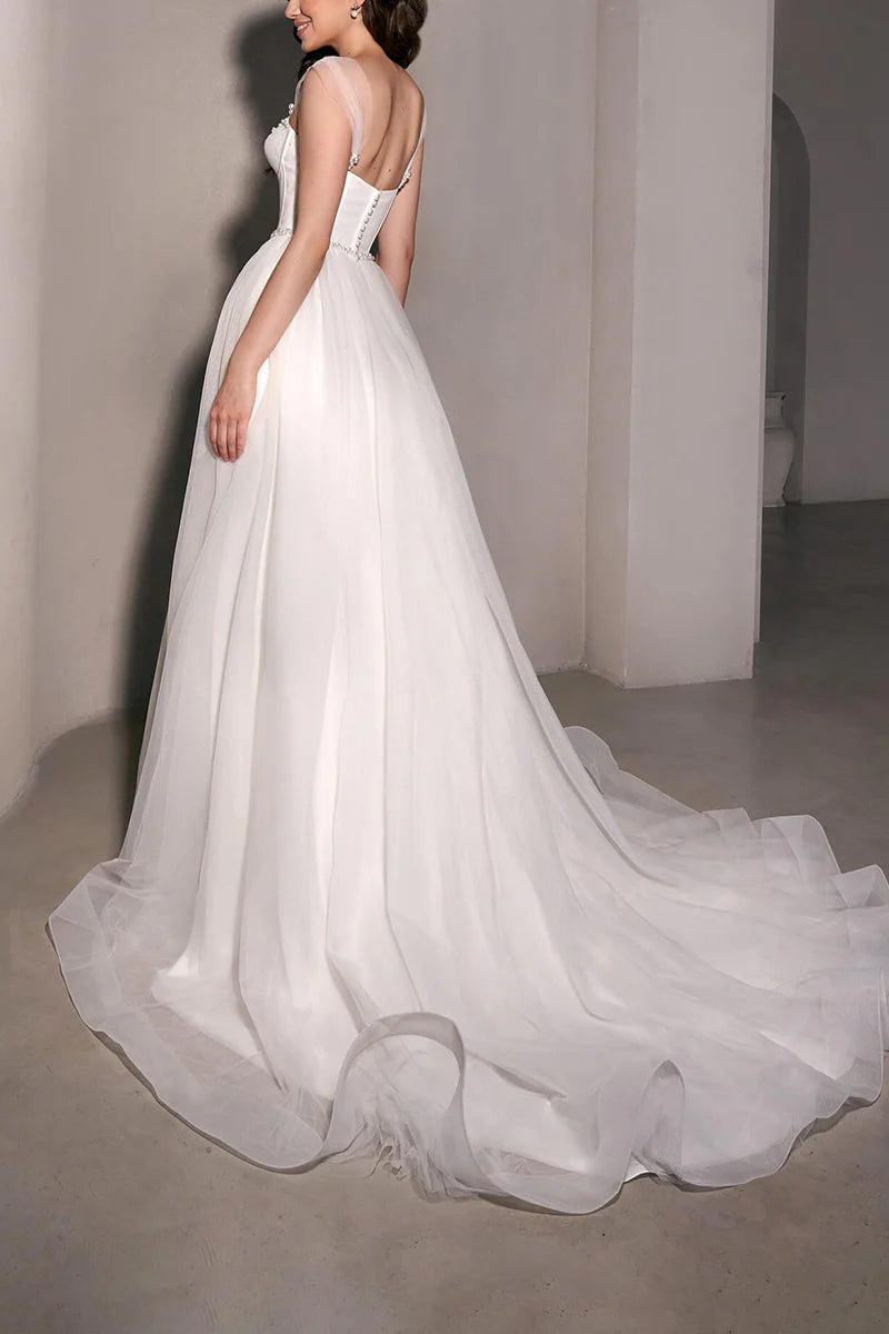 Back view of the A-line sweetheart tulle bridal gown.