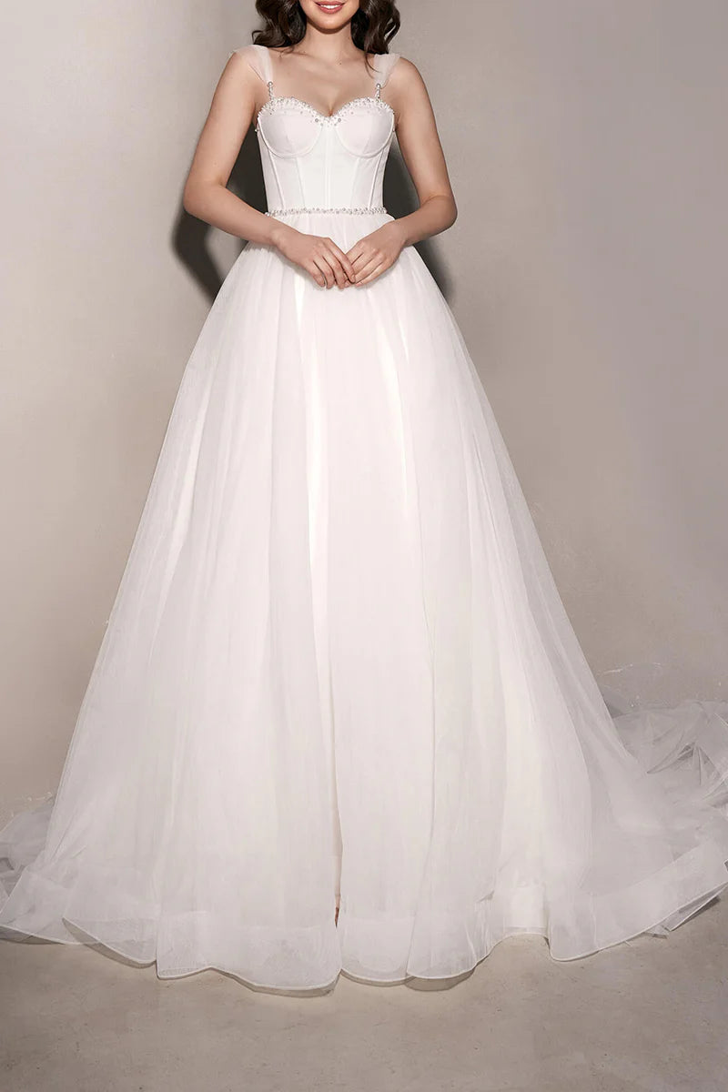 Side profile of the simple A-line wedding dress.