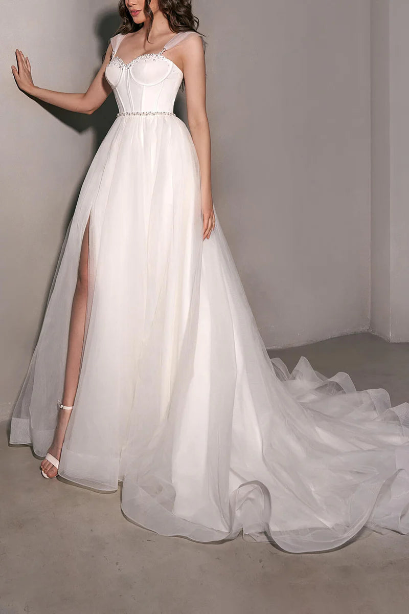 Bride in a flowing A-line tulle wedding dress.