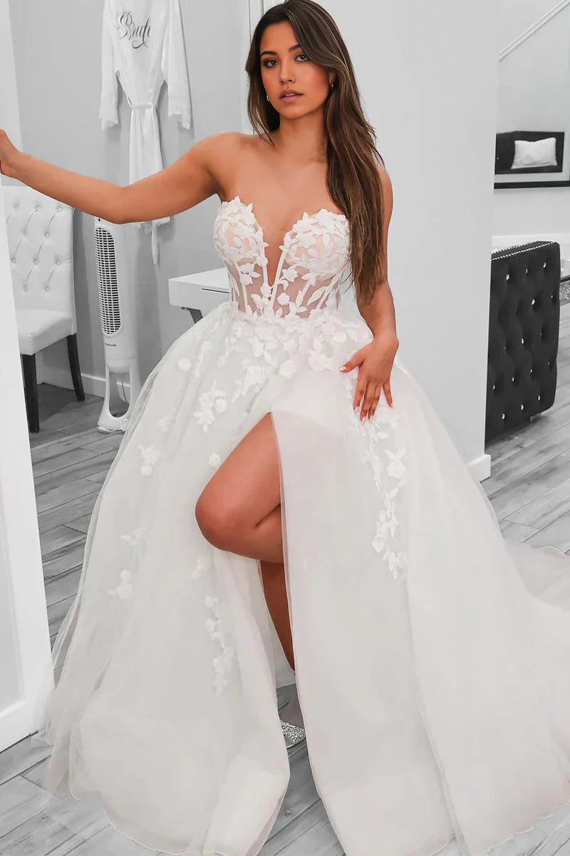 Elegant A-line sweetheart tulle wedding dress with a high slit, shown from the front.