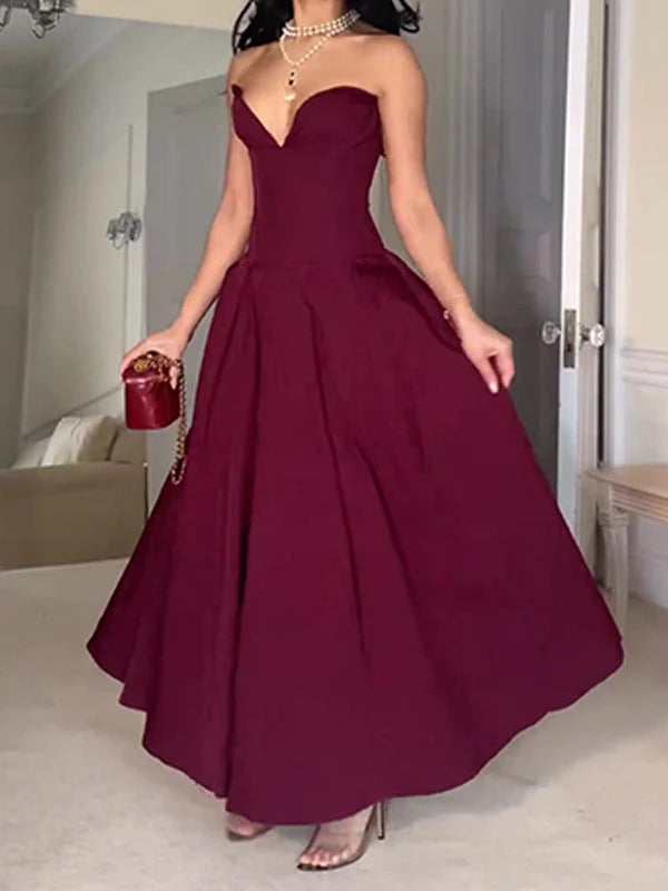 Back view of the elegant burgundy A-line gown.