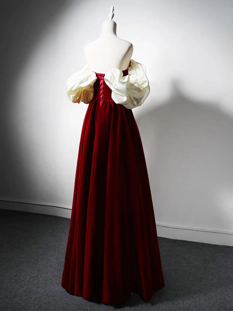 Back view of a woman in a dark velvet A-line sweetheart neck formal gown.