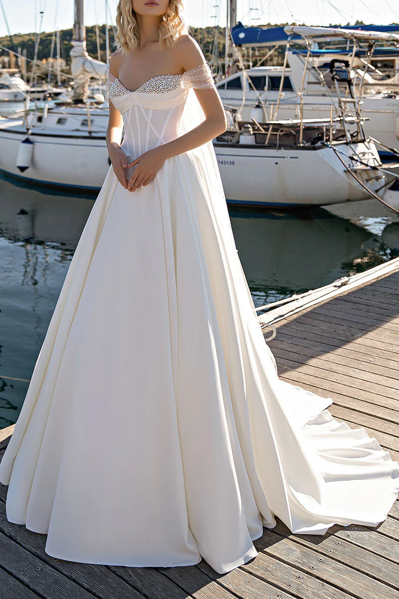 Elegant A-line wedding dress with a sweetheart neckline on a model.