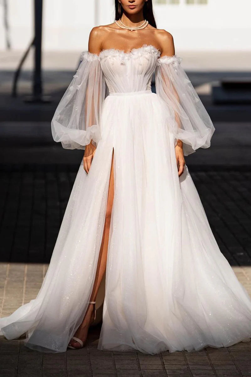 Side view of elegant A-line wedding dress with flowing skirt.