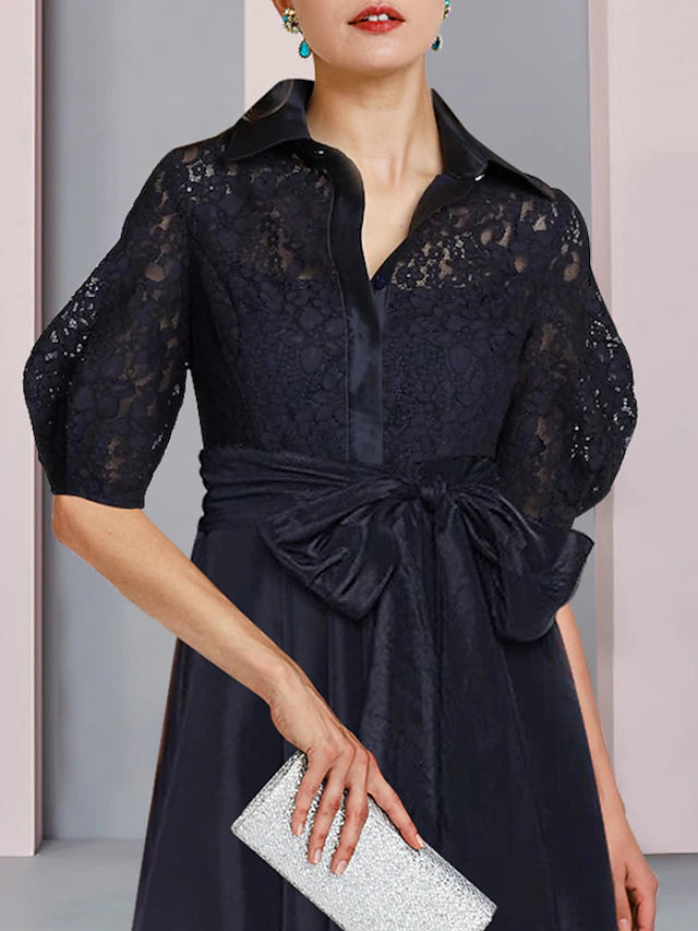 Side view of the A-line taffeta dress, showcasing the high-low hem and pleats.