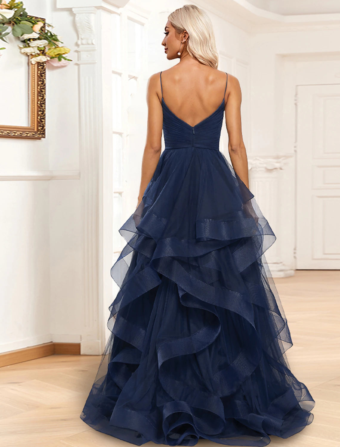 Side view of the A-Line tiered plisse organza gown, highlighting the sweep train and high slit.
