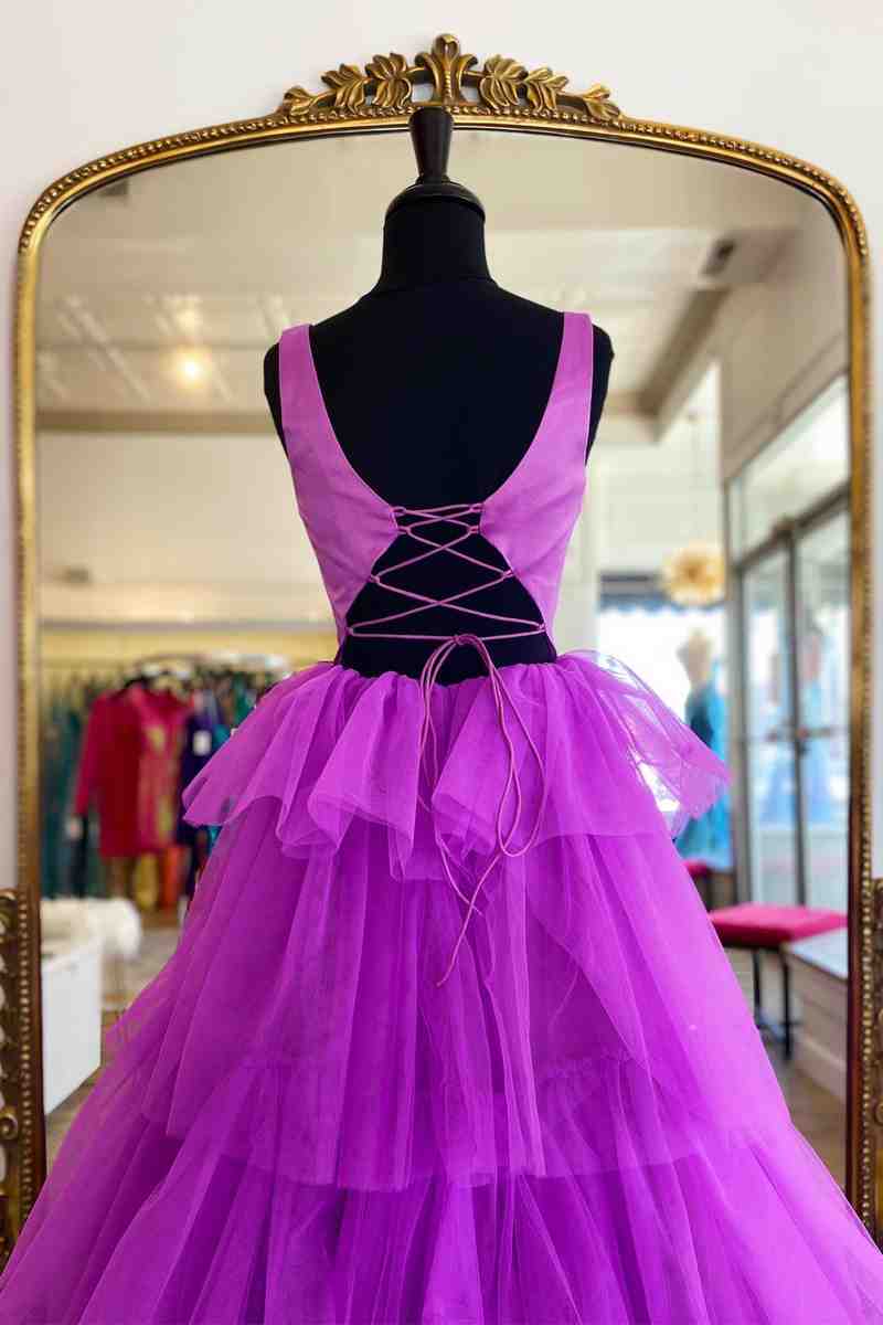 Side view of a model in the A-line tiered tulle long prom dress, showcasing the flowing skirt.