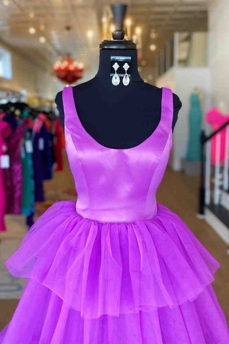 Close-up of the tiered tulle skirt and crew neck detail on the long prom dress.