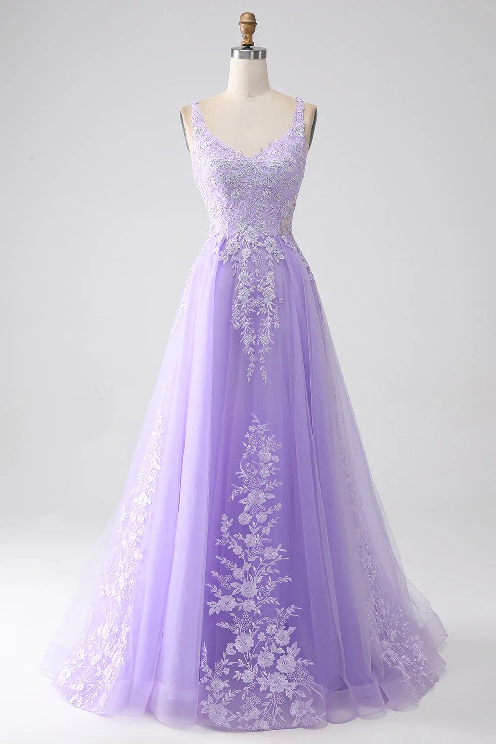 Elegant A-line lilac prom dress with spaghetti straps and appliques.