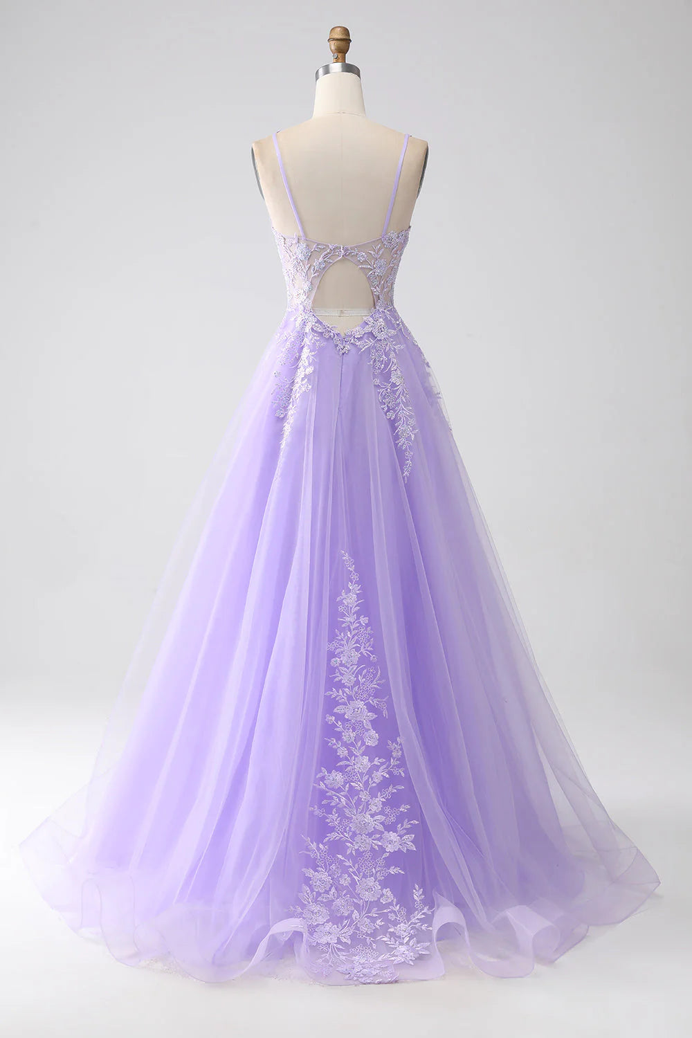 Side view of a long lilac tulle prom dress with delicate appliques.