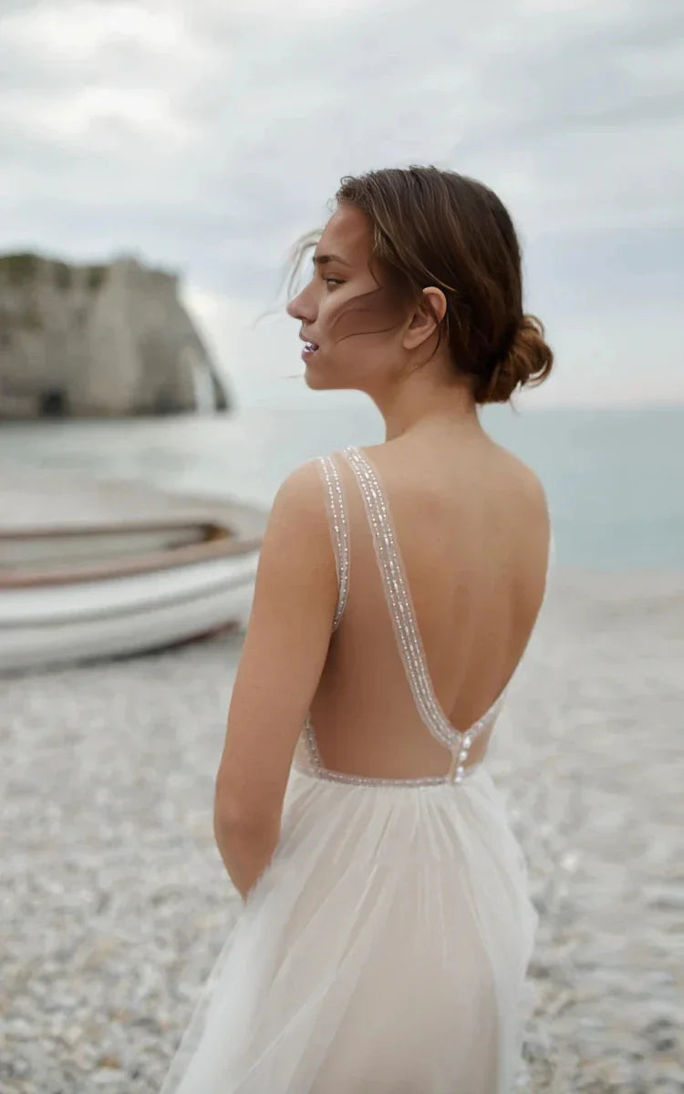 Back view of the A-line tulle gown featuring an open back design.