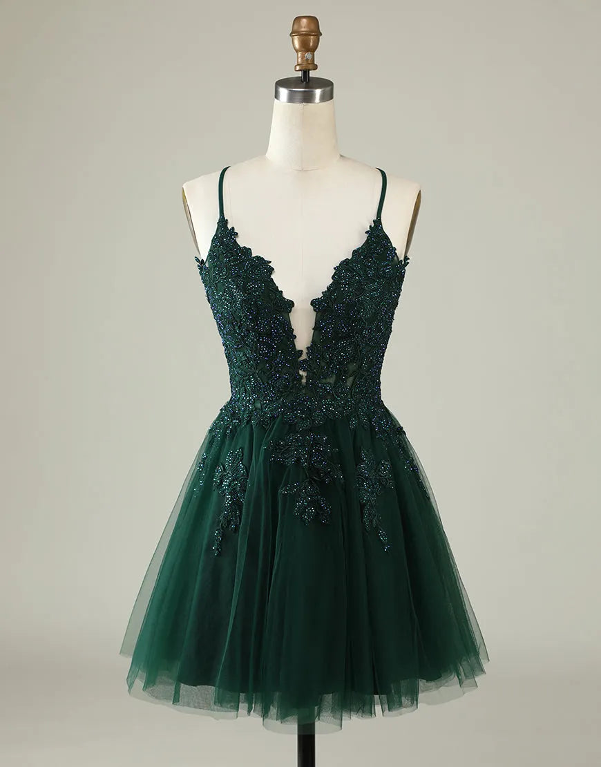 Elegant A-line tulle dress with spaghetti straps, corset back, and floral appliques.