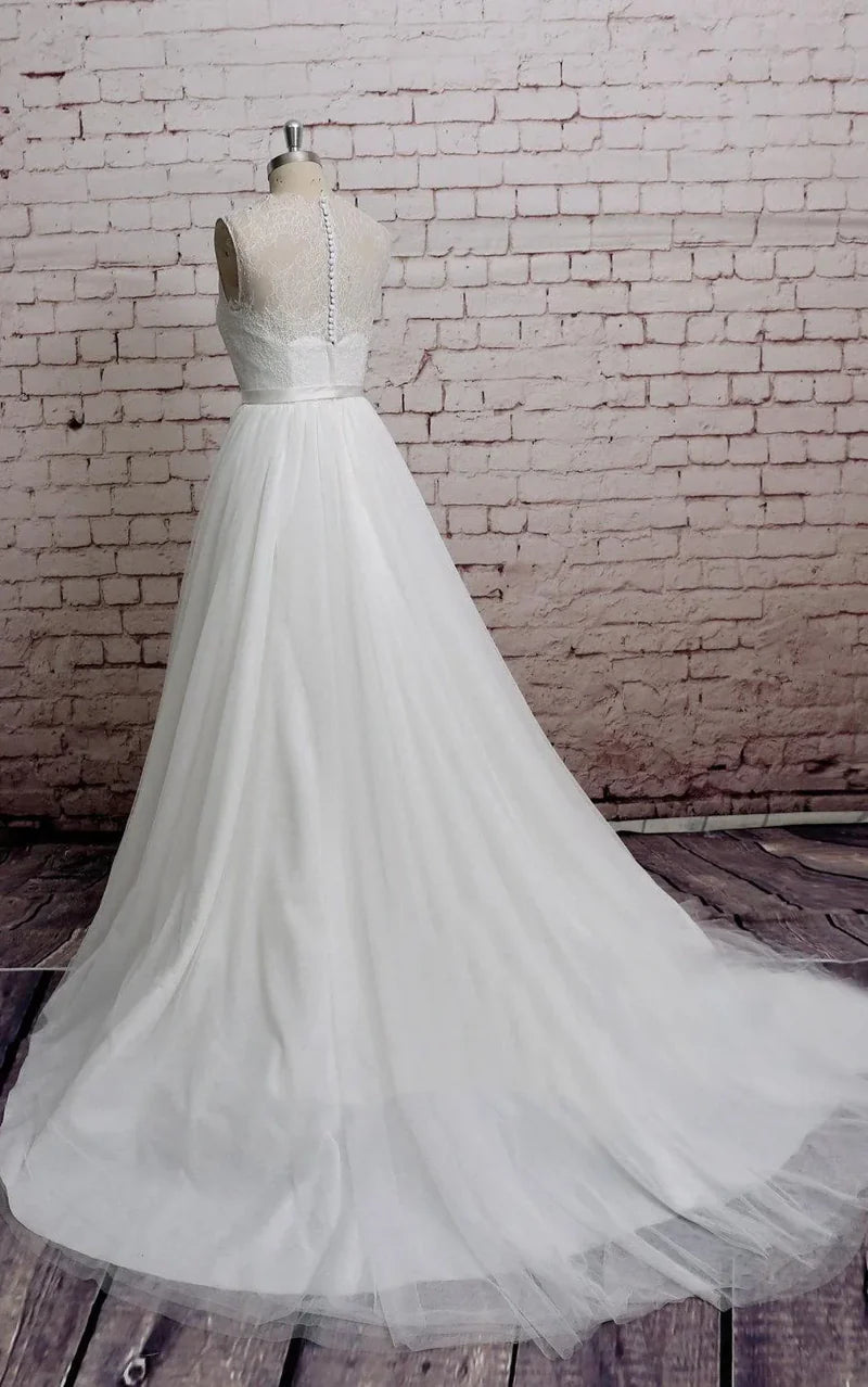 Back view of an elegant A-line bridal gown with a sheer tulle neck.