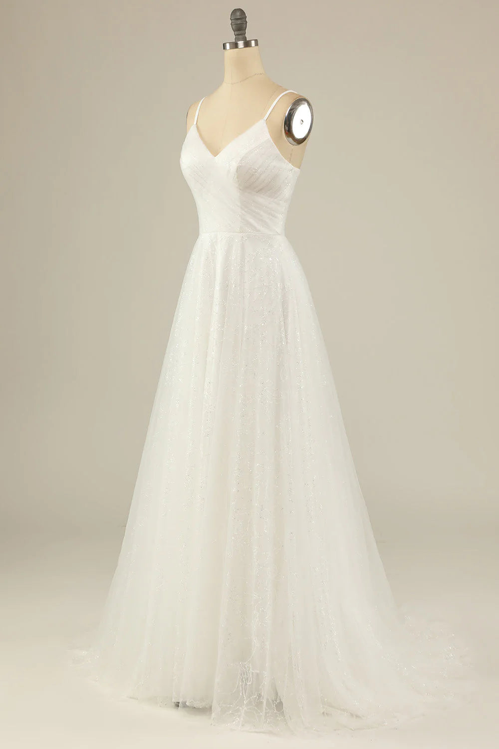 Detail of the spaghetti straps and ethereal tulle fabric.