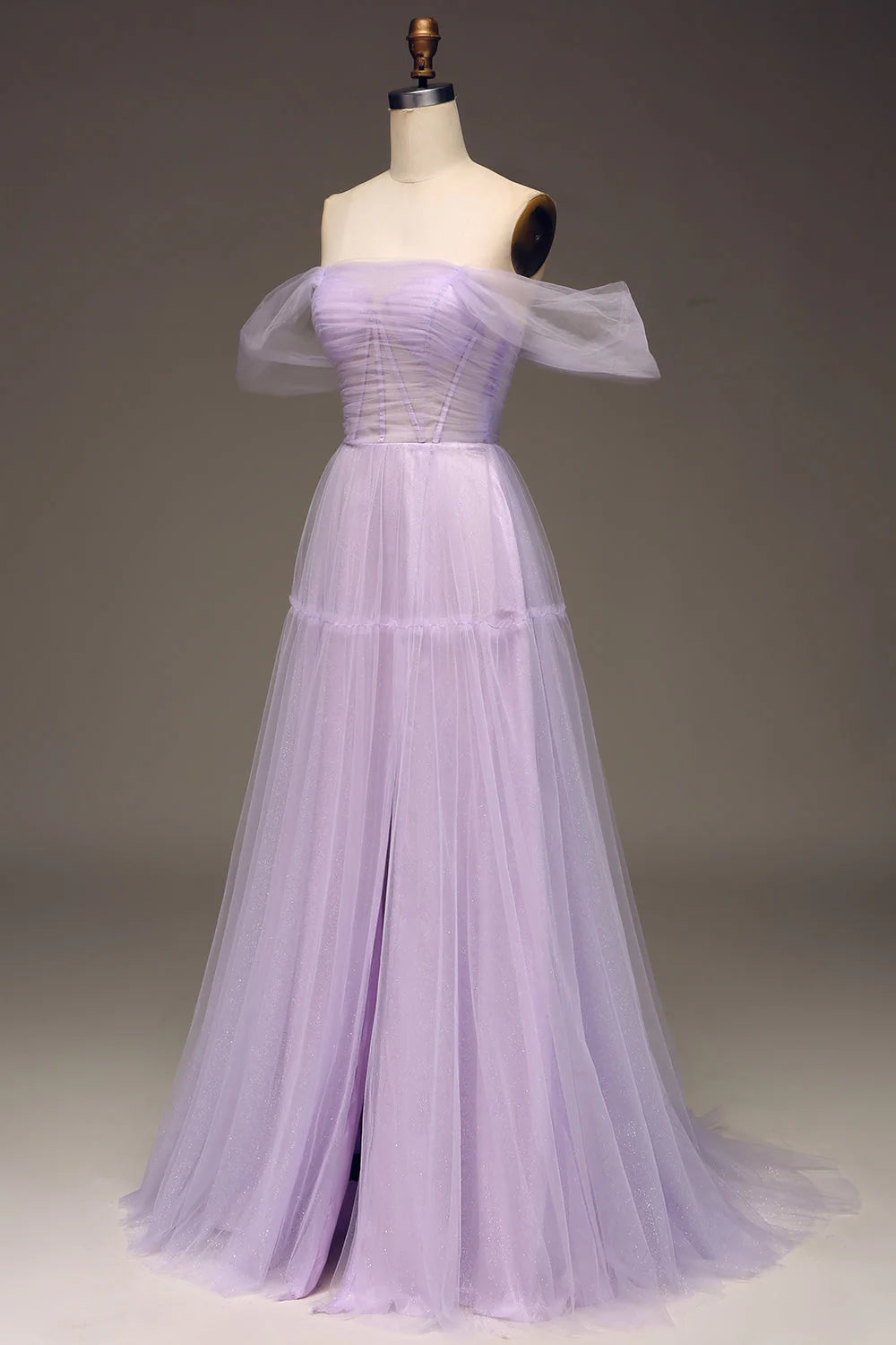 Side view of a princess-style lilac tulle dress, highlighting the leg slit.