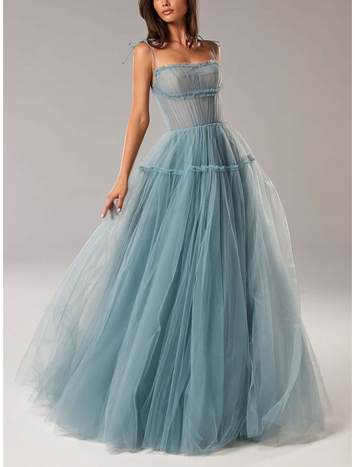 Model posing in the A-line wedding guest dress, showing its elegance.