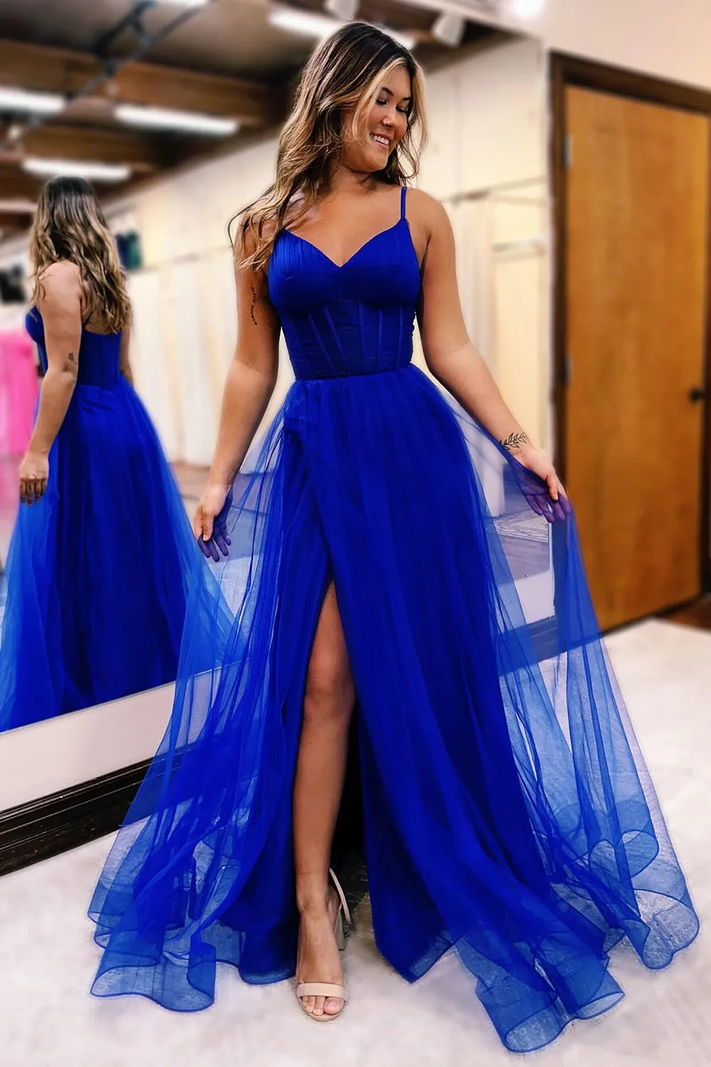 Close-up of the spaghetti straps and slit on the A-Line Tulle Prom Dress.