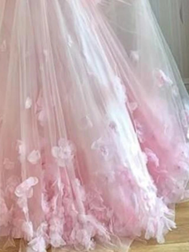 Side profile of the floor-length A-line dress with delicate appliques.