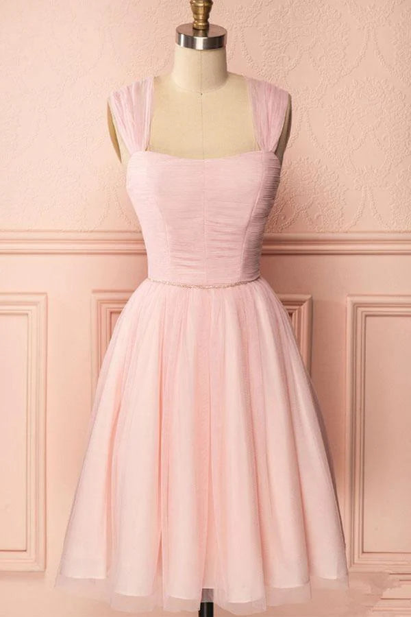 Pink A-line tulle homecoming dress with delicate straps, pleats, and sparkling beading.