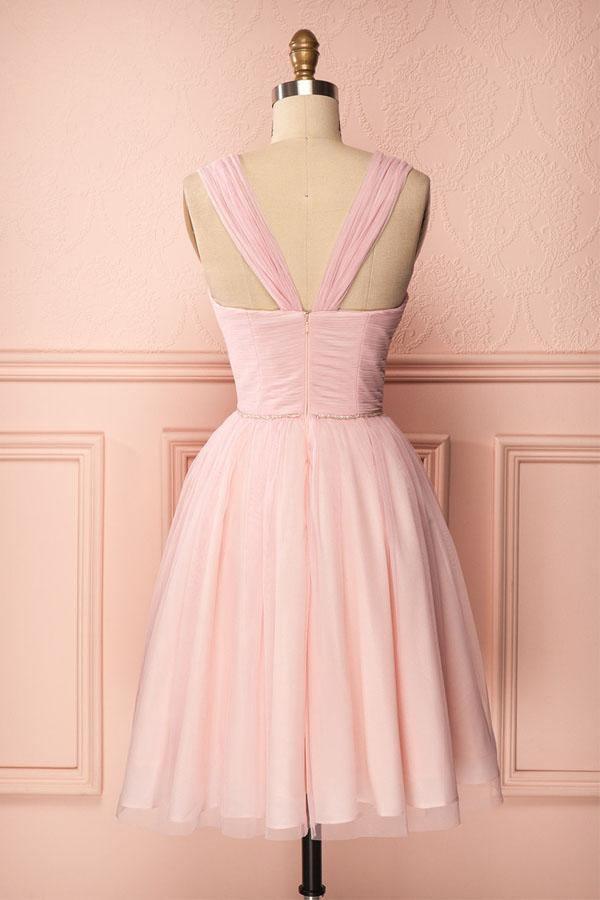 Elegant pink A-line dress for homecoming, showcasing pleated skirt and beaded bodice.