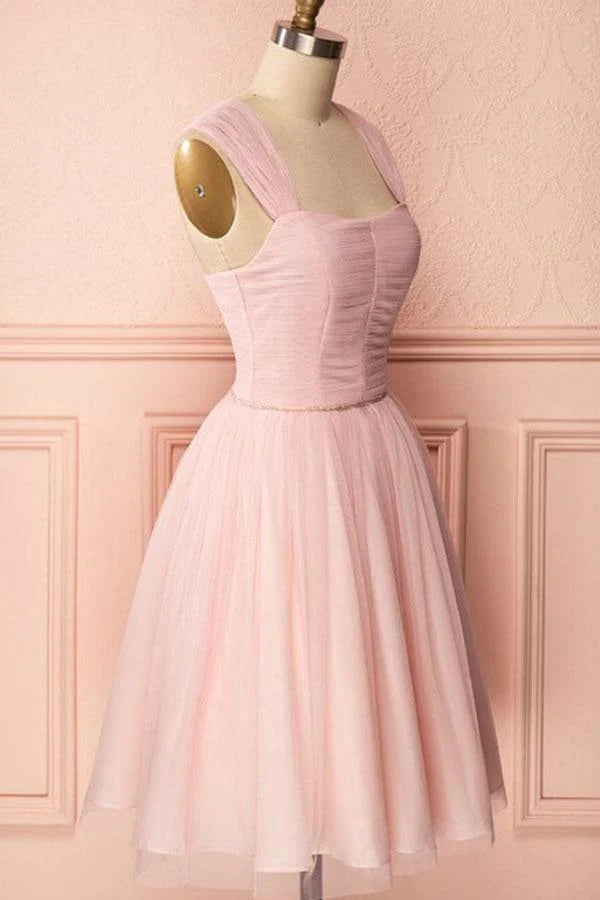 Short pink A-line tulle dress with spaghetti straps, perfect for prom or formal events.