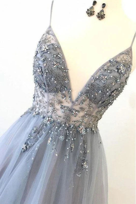 Back view of the A-line tulle prom dress showing flowing skirt and appliques.